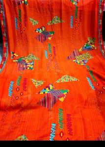 Vibrant Orange Saree with Colorful Motifs