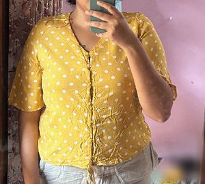 white polka dotted yellow top