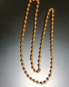 Elegant Gold Beaded Necklace with Swastik
