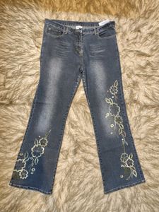 Whimsical Floral Embroidered Denim Jeans
