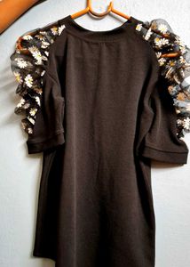 Chic Black Top with Floral Puff Sleeves