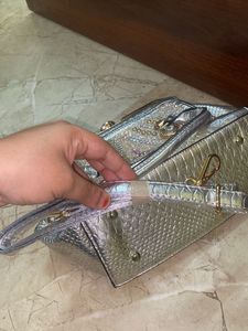 silver solid hand bag