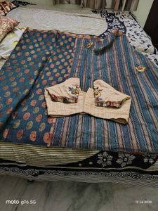 Elegant Teal Saree with Floral Motifs