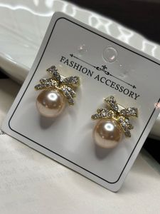 Pearl Bow Stud Earrings