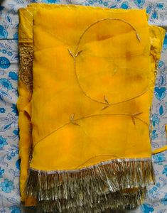 Embroidered Yellow Rajasthani poshak.