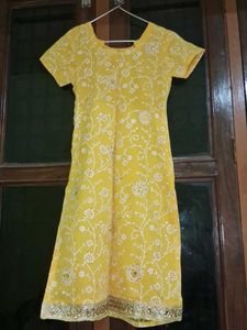 Yellow kurta with churidar and dupatta