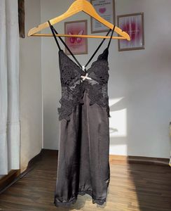 Black lace slip dress with criss cross back