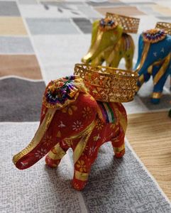 set of five elephants with diya on it