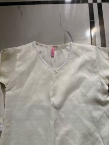 NewElegant Cream Kurta with Lace Trim