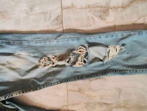 Ripped Light Wash Denim Jeans