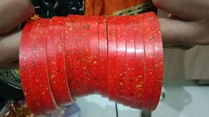Vibrant Red Bangles with Speckled Design