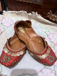 Embellished orange Juttis