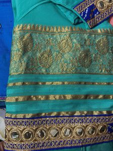 Stunning Teal Saree with Gold Border