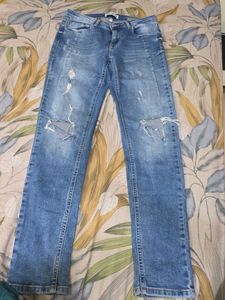 Distressed Blue Denim Jeans