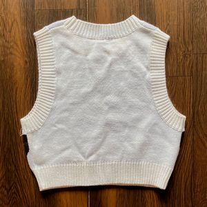 PATTERNED KNITTED PULLOVER VEST