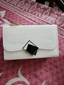 26.Chic White Clutch with Gold Chain