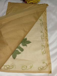Elegant Beige Saree with Green Floral Embroidery