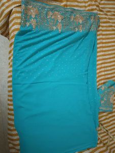 Turquoise Saree with Gold Embellishments