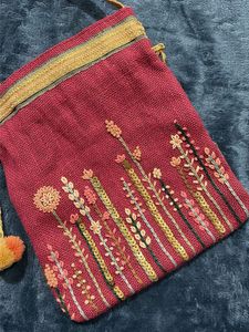 Embroidered Potli Bag with Pom Poms