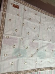 Brown Floral Bordered White Saree