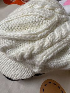 creamy-white knit,  textured cable pattern