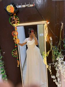 white full length gown with too much detailing