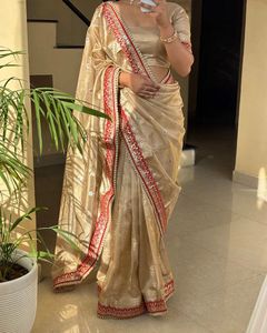 Elegant Golden Saree with Red Border