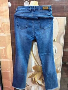 Distressed Blue Denim Jeans