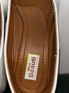 Stylish White Pointed Toe Flats with Embellishment