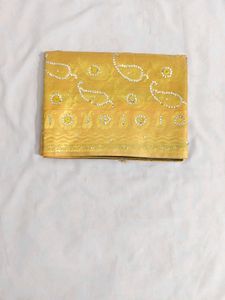 Beautiful Golden Saree with Paisley Motifs