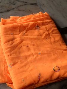 Vibrant Orange Saree with Delicate Floral Motifs