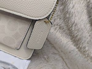 Coach Tabby Off White with c print.
