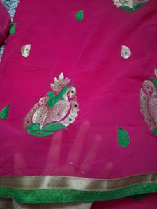 Vibrant Pink Saree with Peacock Motifs