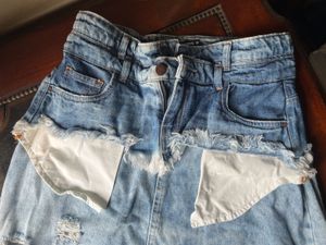 Y2K style distressed denim skirt
