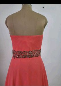 Elegant Strapless Coral Gown with Embellished Wais