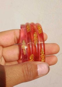 Elegant Red Bangles with Gold Accents