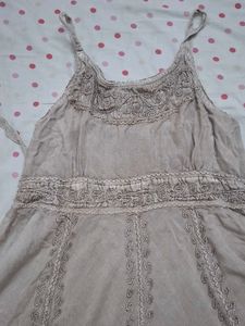 sleeveless dress over jeans top