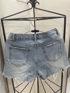 Distressed Light Wash Denim Shorts