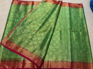 Green Silk Saree with Gold Border