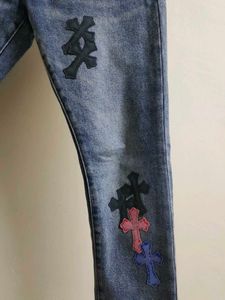 Chrome Hearts cross patch graphic blue jeans