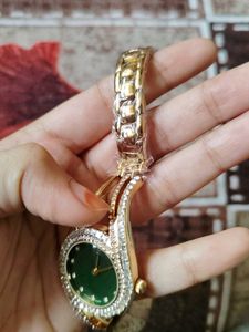 Elegant Gold Watch with Green Dial