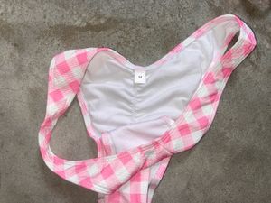 tri-bralette style bikini top and pink bot