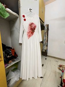 elegant white gown with floral emblishmnent