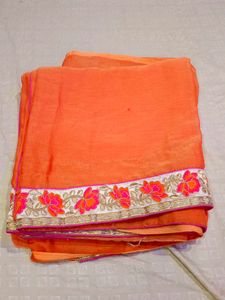 Vibrant Orange Saree with Embellished Border