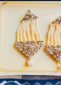 heavy gold and pearl earrings