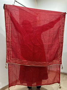 Red lehenga with matching dupatta and golden blous