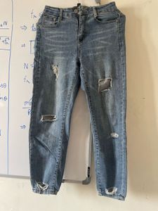 Distressed Blue Denim Jeans