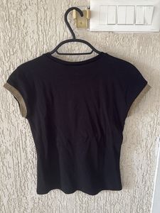 Chic Black Top with Gold Accents