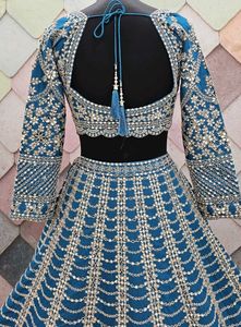 Exquisite Teal Embellished Lehenga Choli