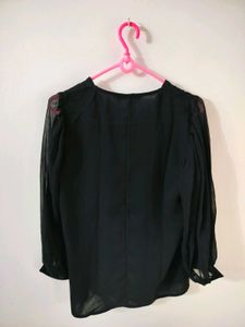 Vero Moda Black Sheer Sleeve Top with nude camisol